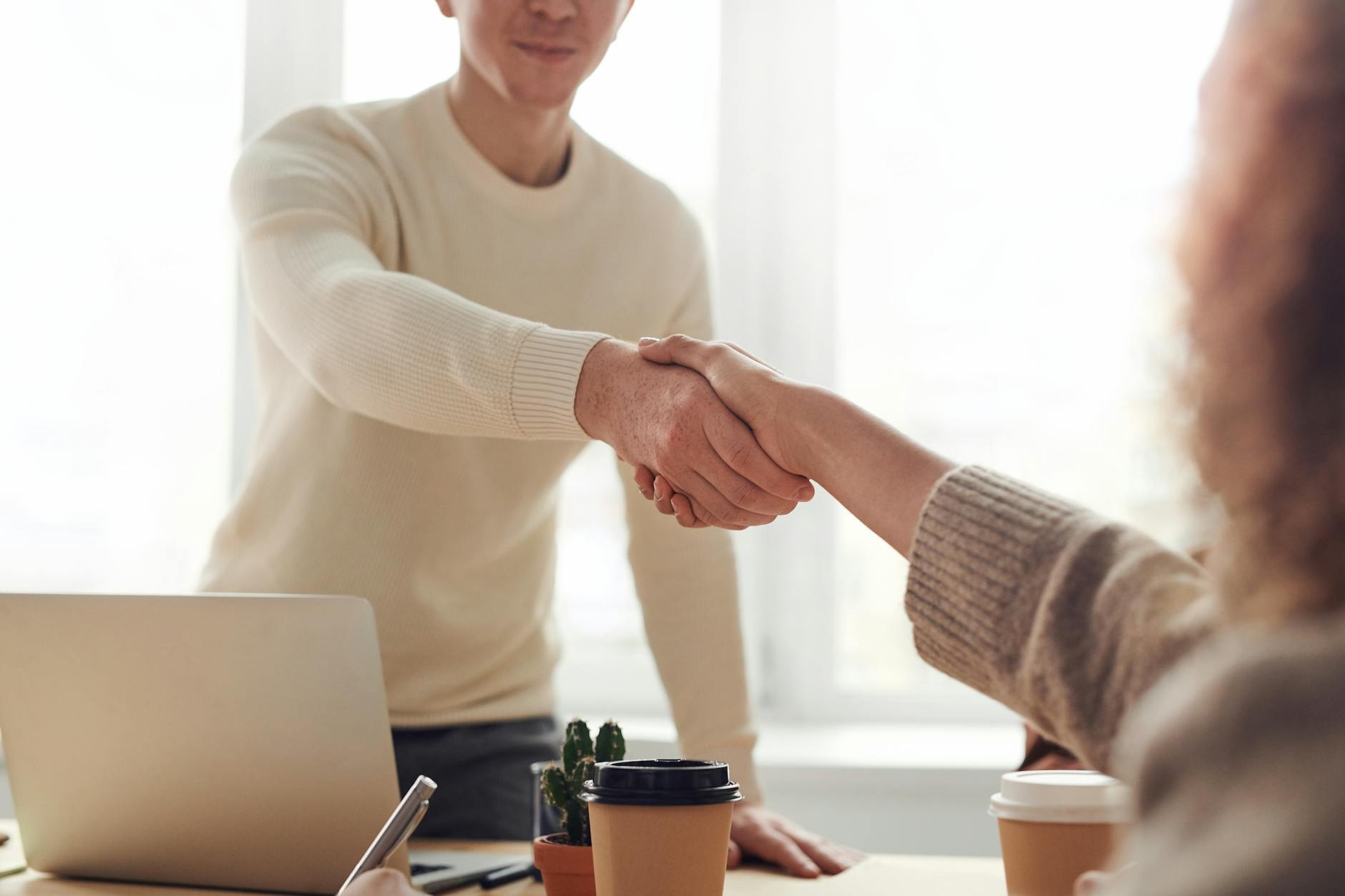 business people shaking hands after interview